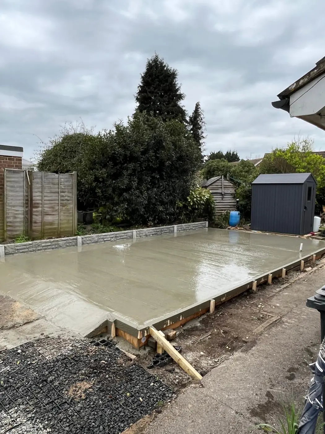 Freshly poured base with stone-effect kerb edging