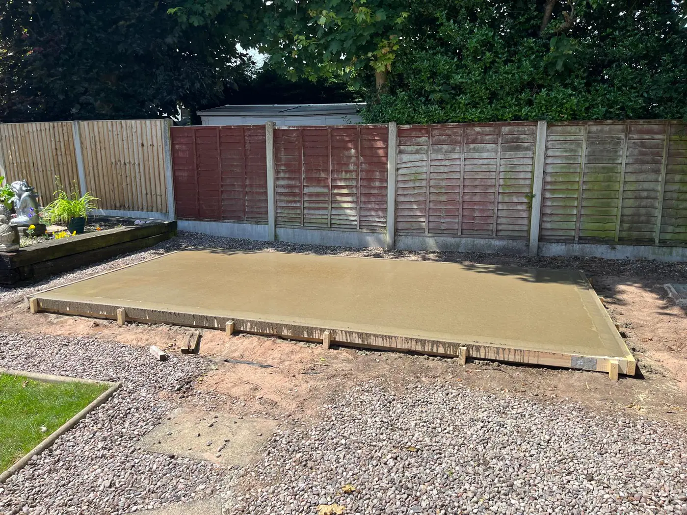 Freshly poured base in an established garden