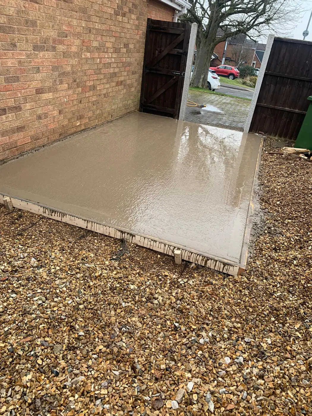 Freshly poured base with gated driveway access