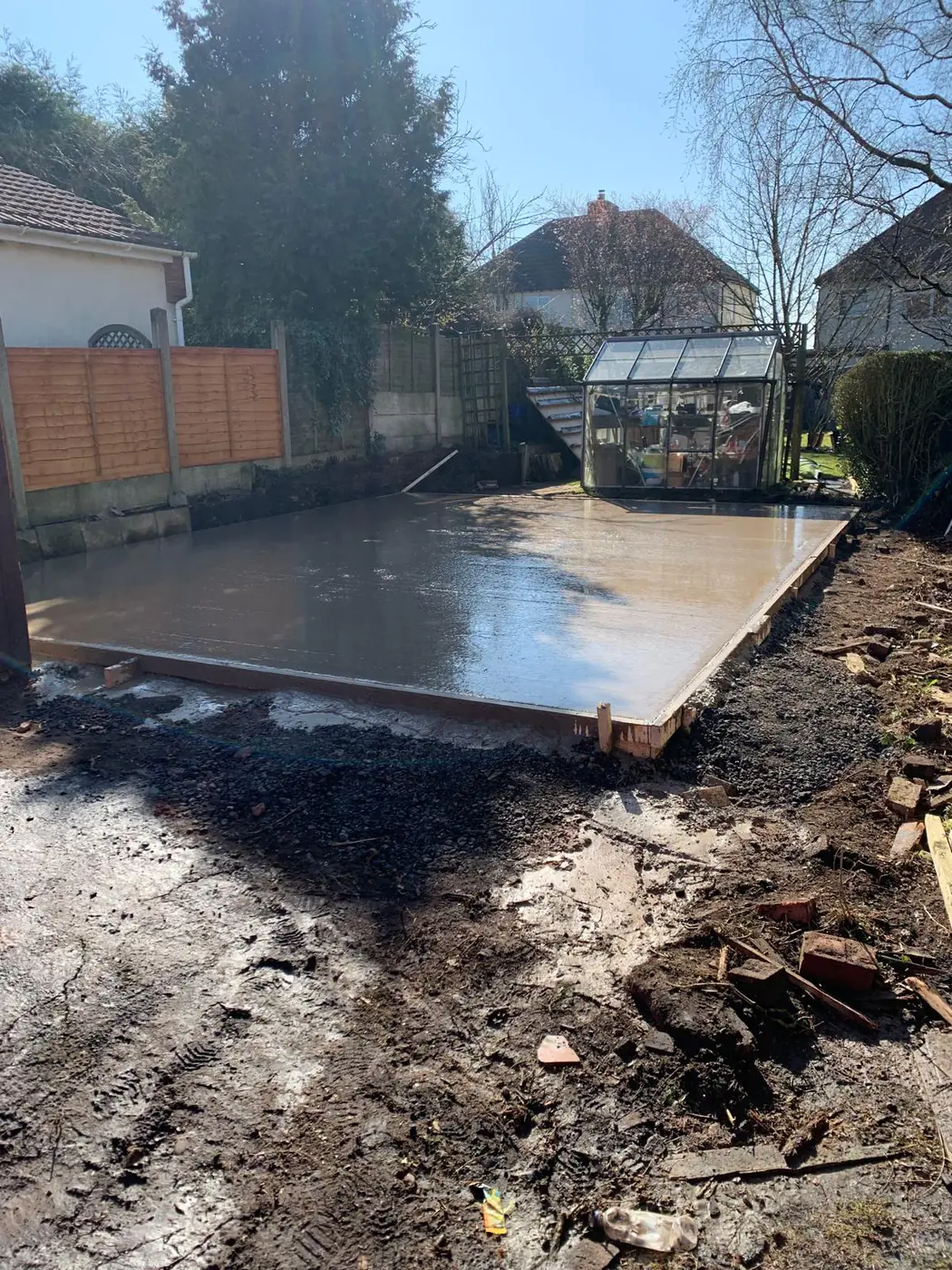 Freshly poured greenhouse and garden building base