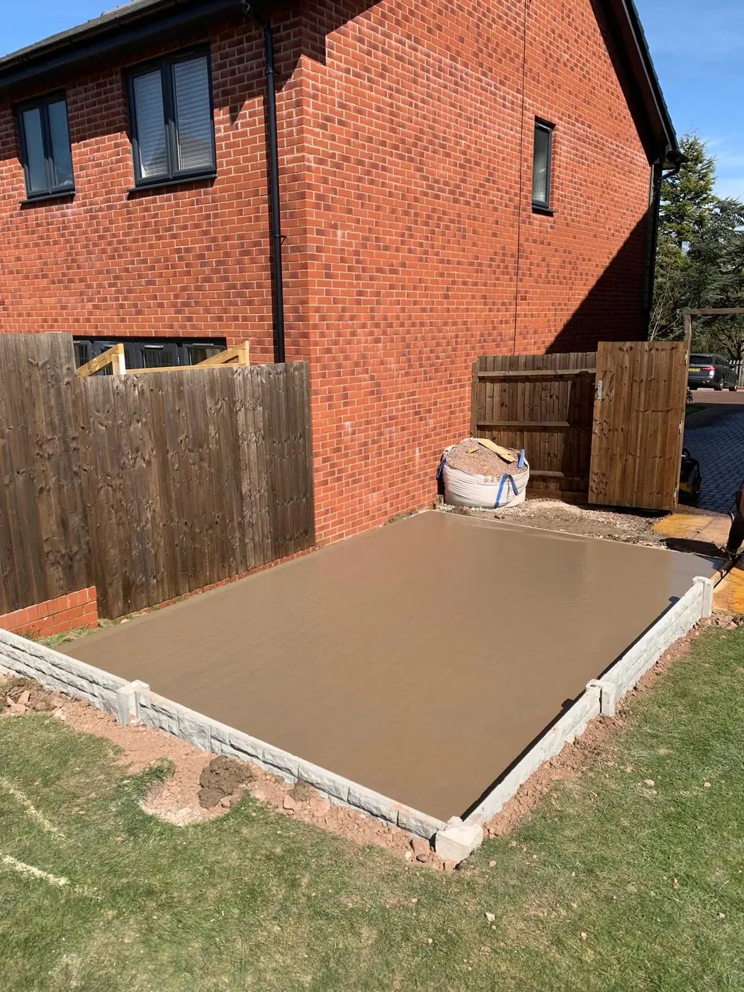 Freshly poured base finished to kerb edging