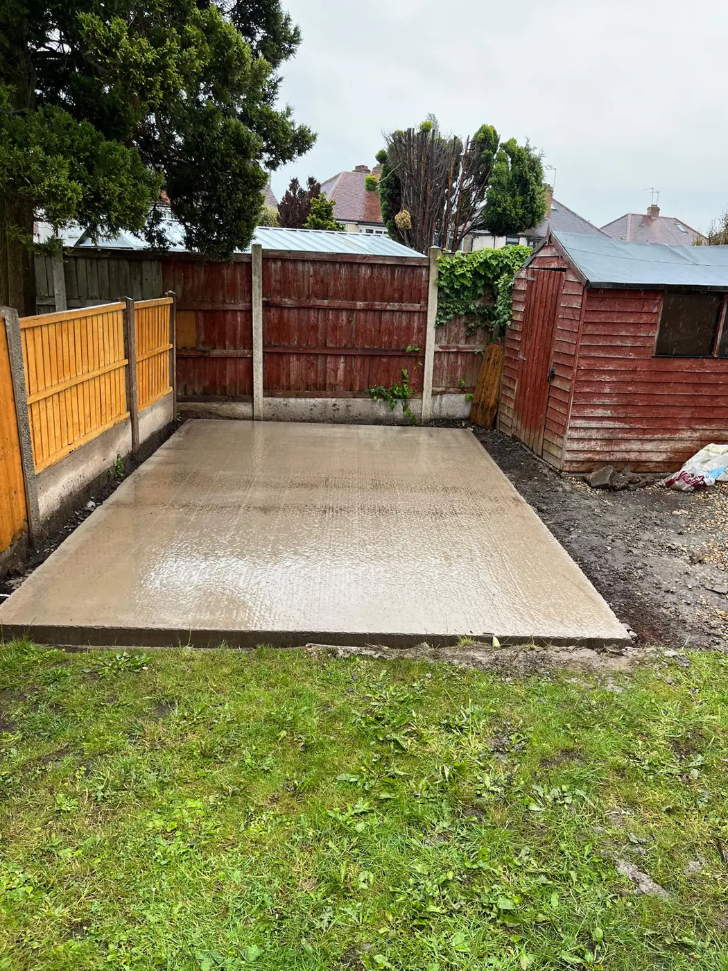 Freshly poured base set into a lawned corner