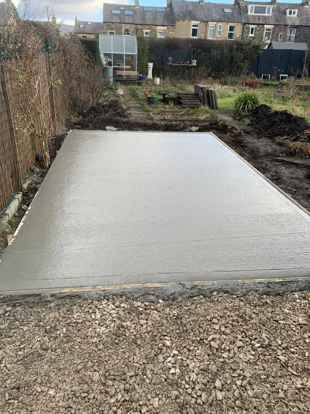 Freshly poured base on a terraced garden plot