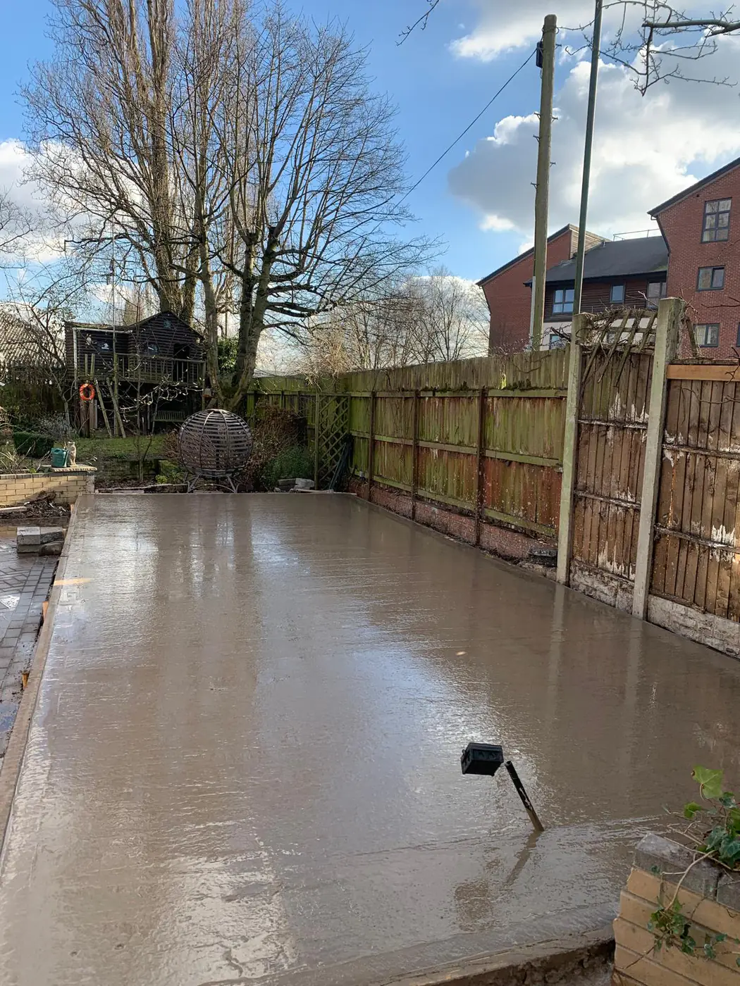 Freshly poured base in a large family garden
