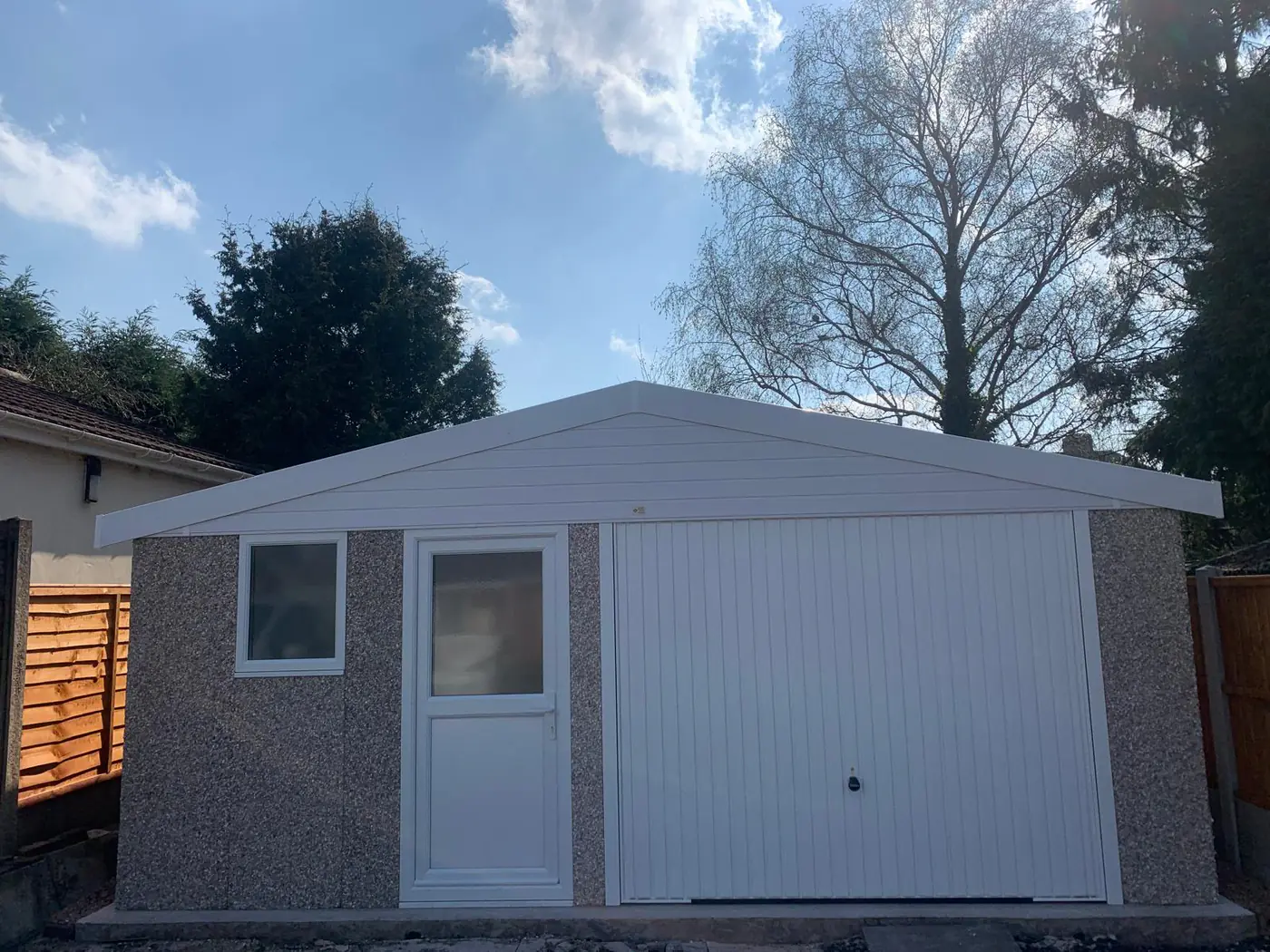 Completed apex-roof garage with pedestrian side door