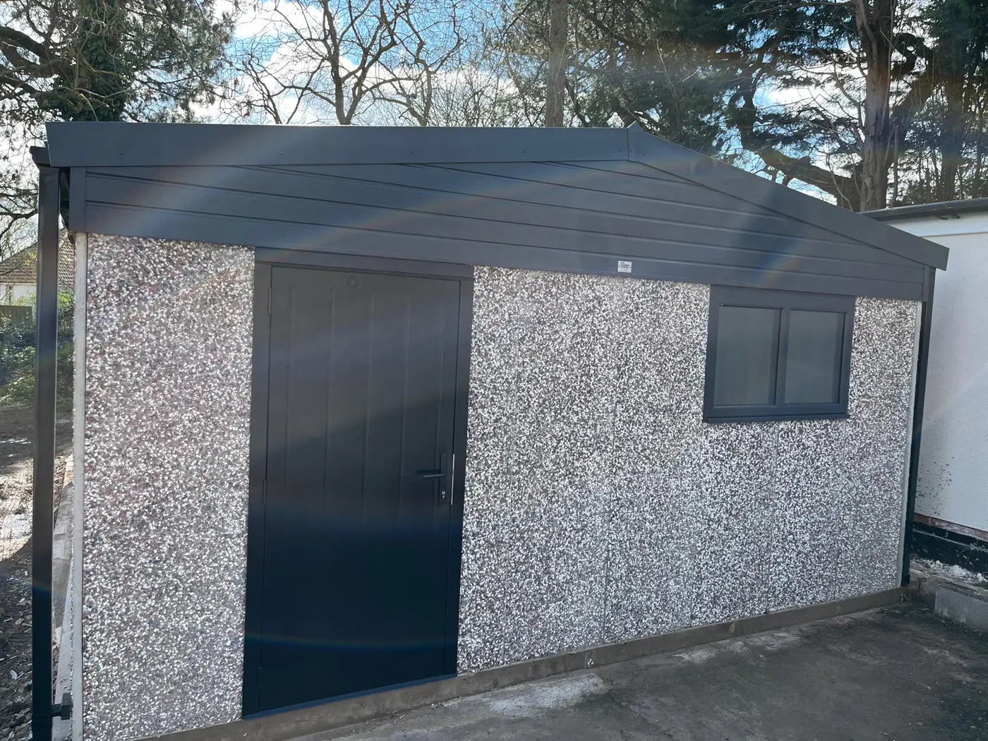 Completed garage in a wooded setting