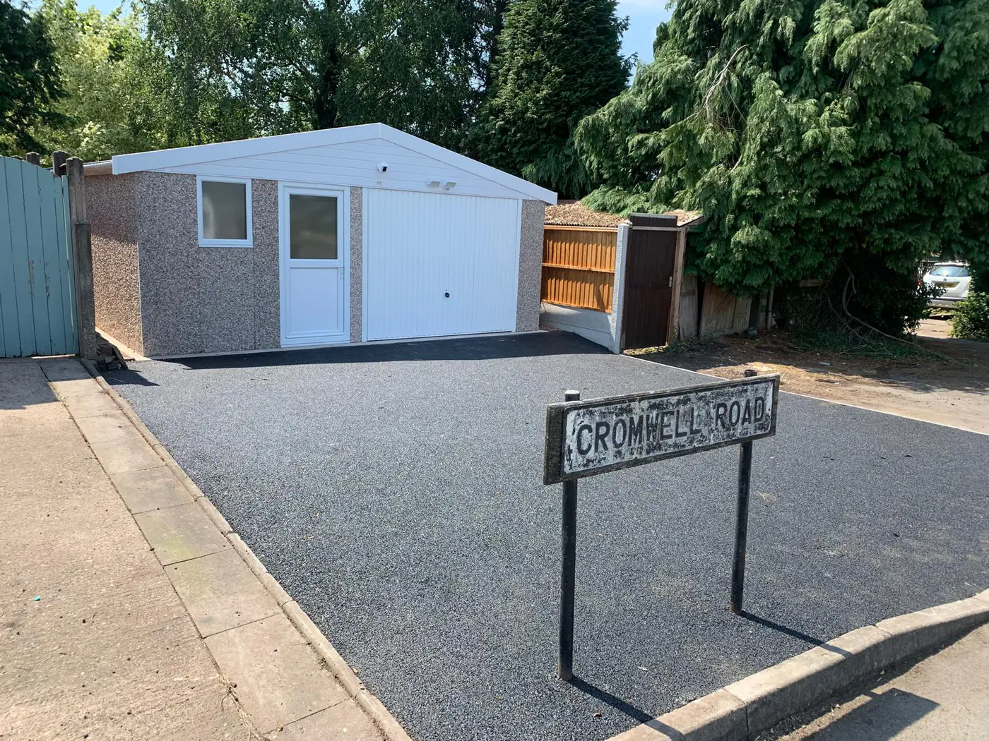 Completed garage with newly laid driveway