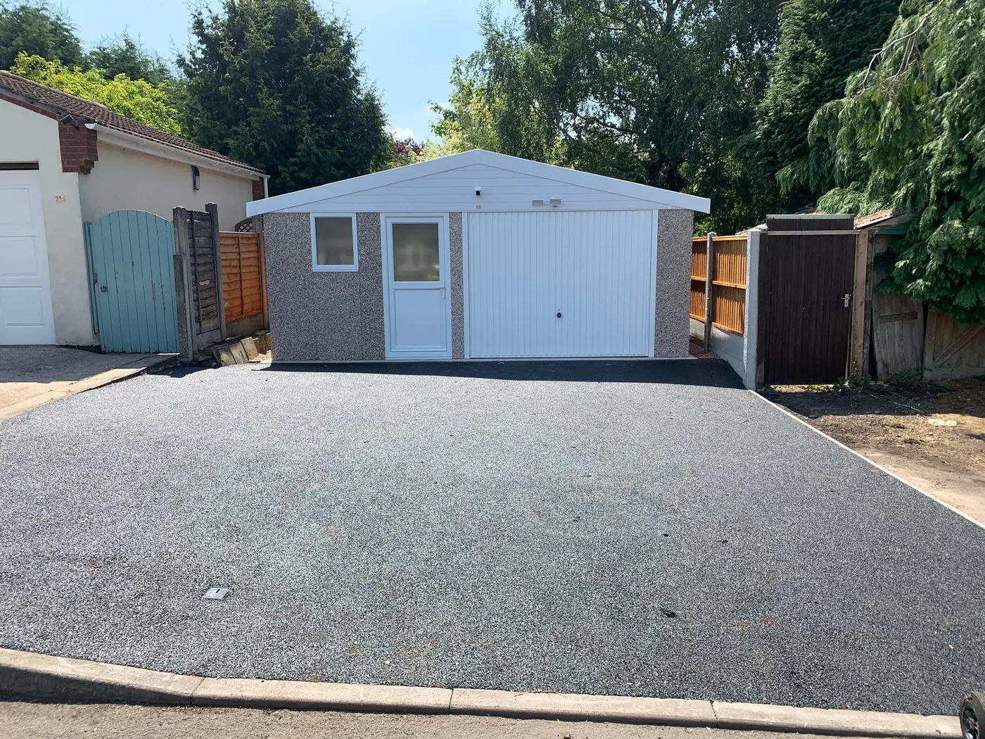 Completed garage and full-width new driveway