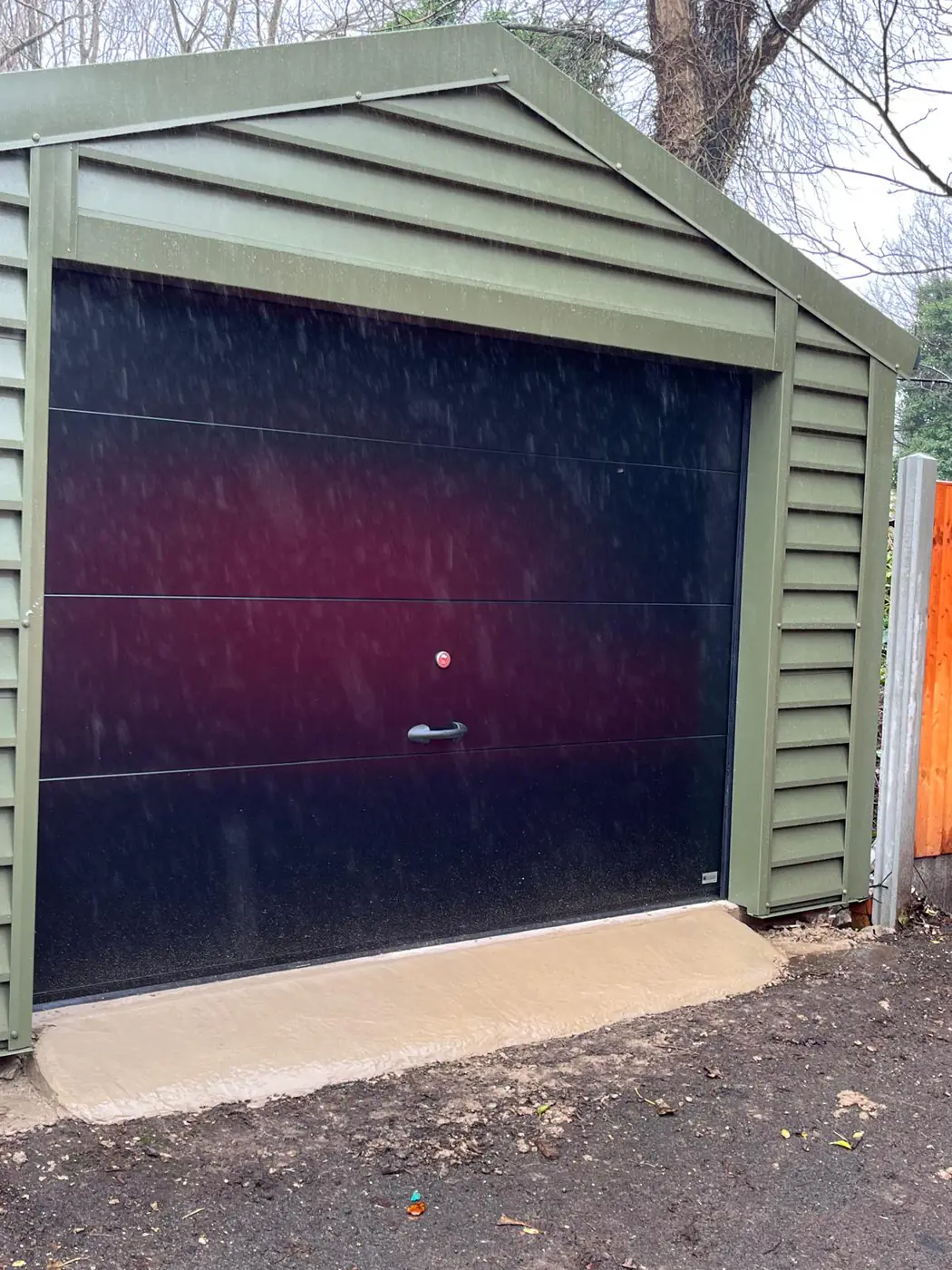 Completed garage in sage cladding