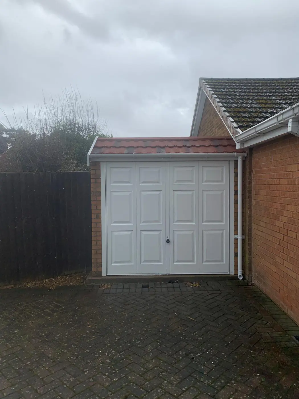 Completed garage with terracotta pantile roof