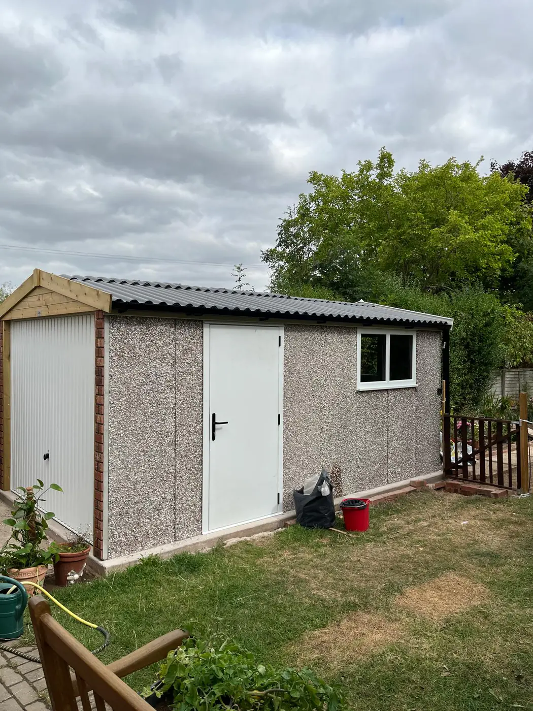 Completed outbuilding with corrugated roof