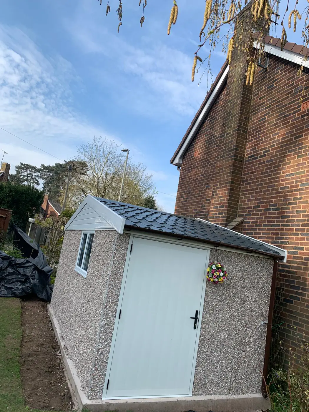 Completed pebbledash garden store