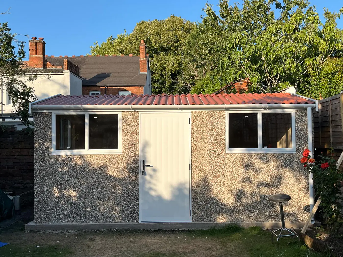 Completed garden building with twin windows