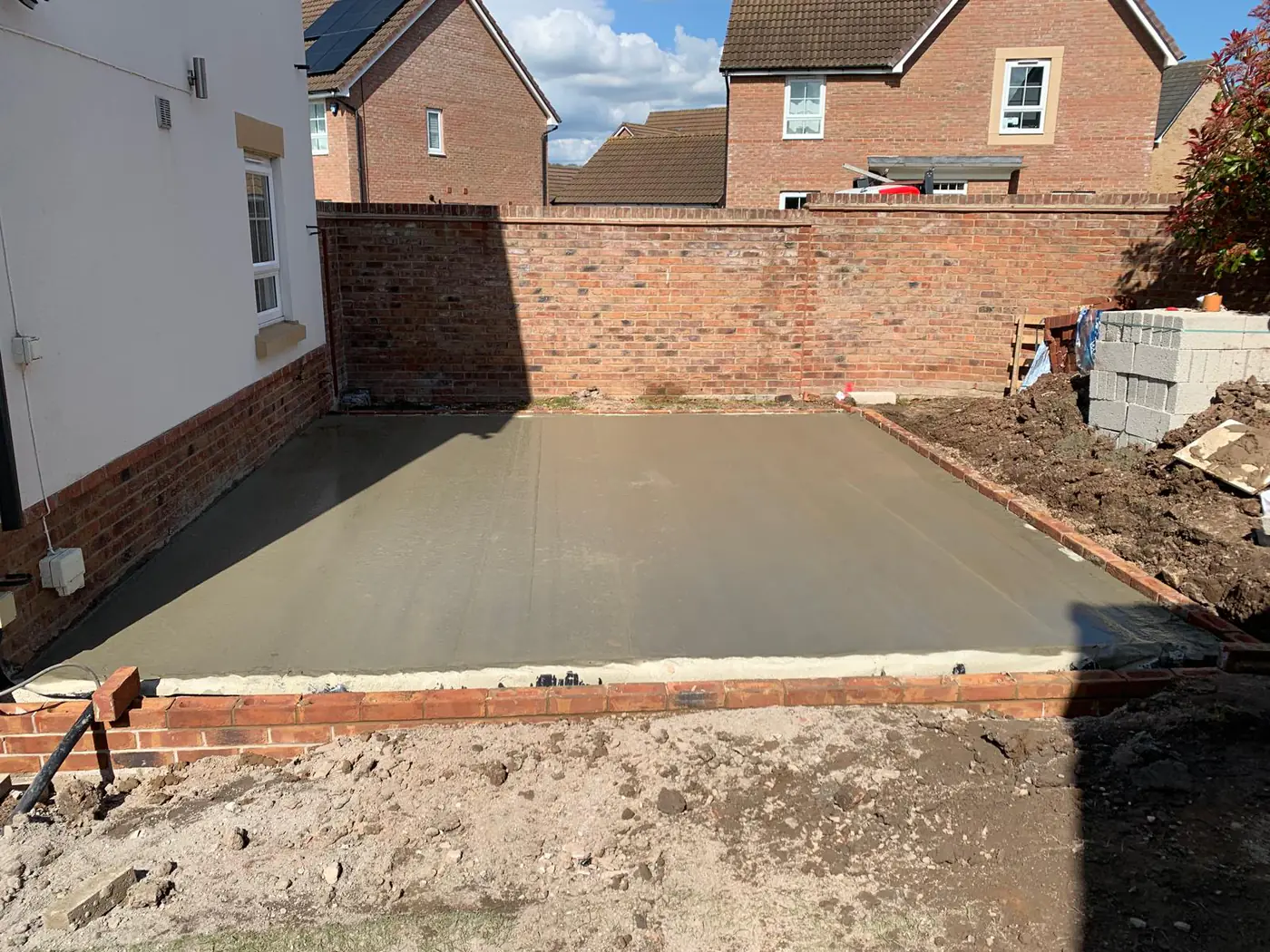 Oversite slab poured within brick foundation walls