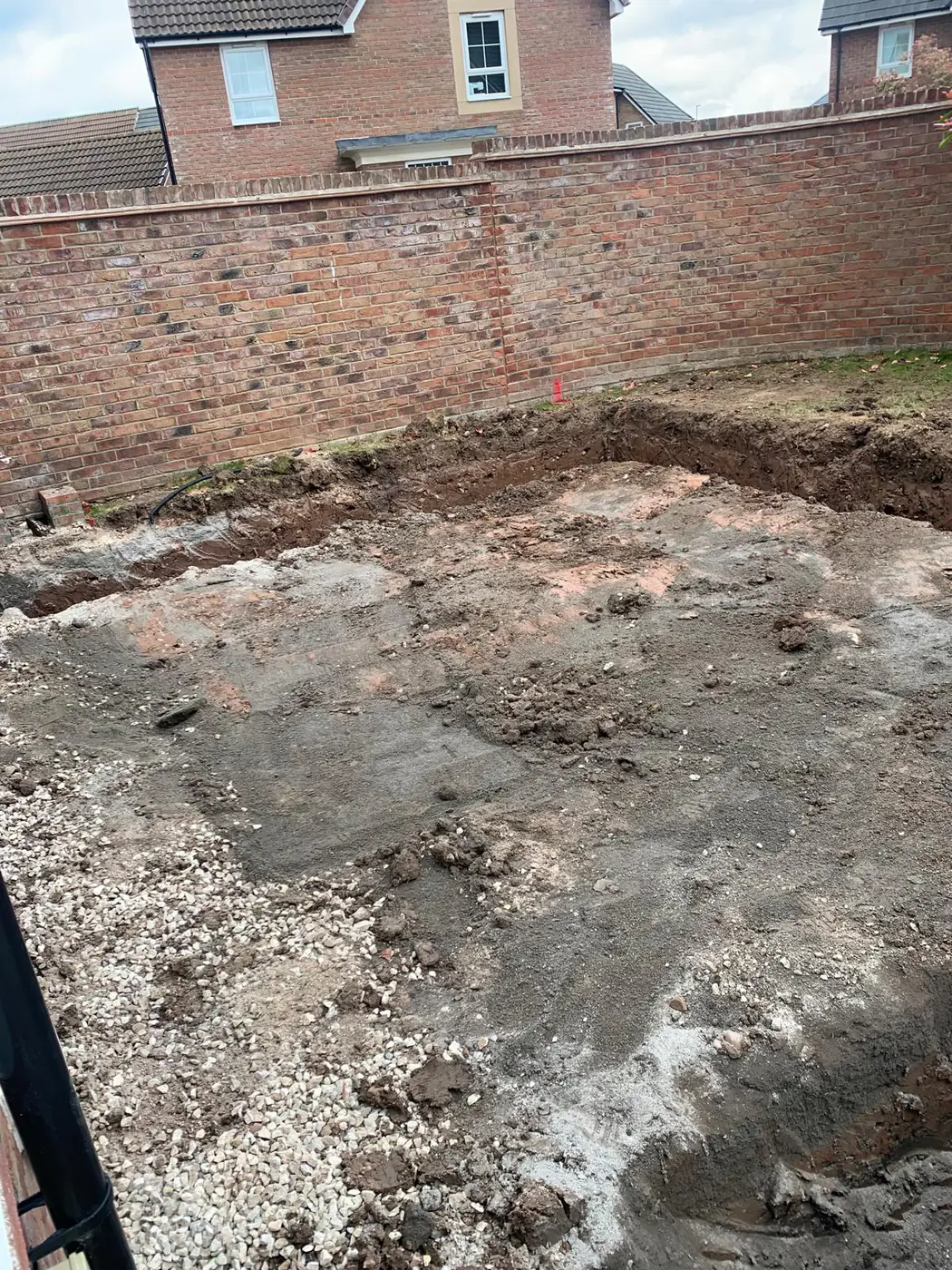 Site excavation within a walled garden